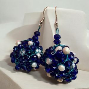 The Crystal and Pearl Drop Earrings blend Czech crystals and freshwater pearls in a handcrafted design. Hypoallergenic with secure hooks (22g each). Customizable for bespoke luxury.